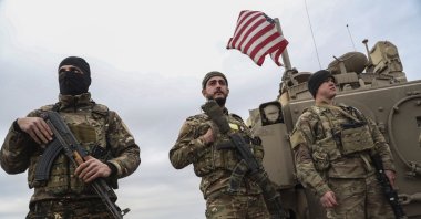 Militants of the U.S.-backed PKK/YPG terrorist group take up positions in the town of Dhiban, Deir el-Zour province, eastern Syria, Sept. 9, 2023. (EPA File Photo)