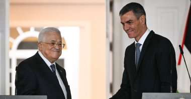President of the Palestinian Authority Mahmoud Abbas (L) shakes hands with Spanish Prime Minister Pedro Sanchez after delivering remarks following their meeting at the Moncloa Palace in Madrid, Spain, Dec. 12, 2025. (AFP Photo)