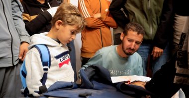  Mourners react next to the body of freelance Palestinian journalist Mahmoud Wadi, who was killed in an Israeli strike on Tuesday, according to local health authorities, at Nasser hospital in Khan Younis, in the southern Gaza Strip, Dec. 2, 2025. (Reuters Photo)