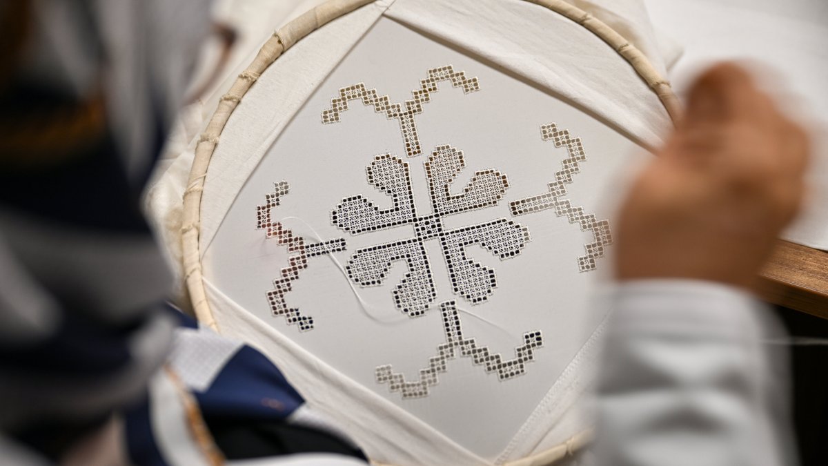 A craftswoman stitches traditional Antep Işi embroidery, Dec. 11, 2025. (AA Photo)