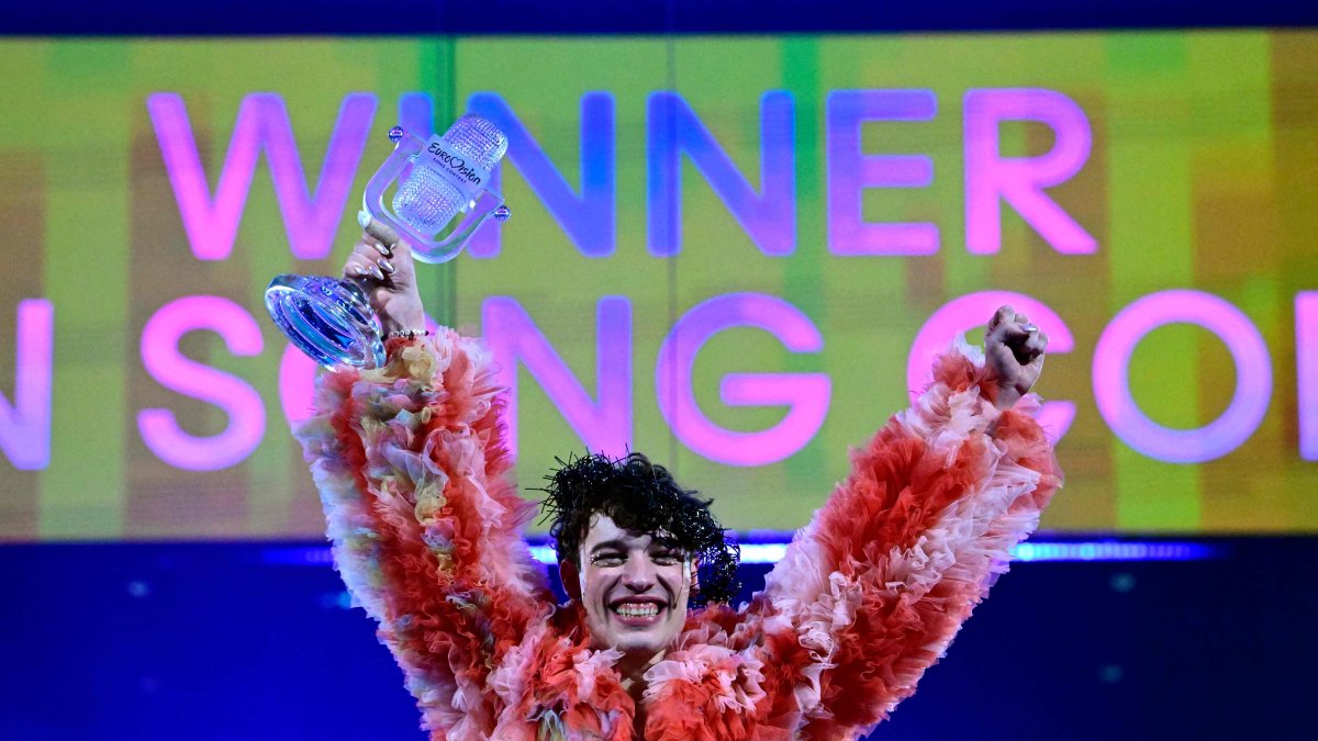 Singer Nemo, representing Switzerland with the song &quot;The Code,&quot; celebrates on stage with his trophy after winning the final of the 68th Eurovision Song Contest (ESC) 2024, May 11, 2024. (AFP File Photo)