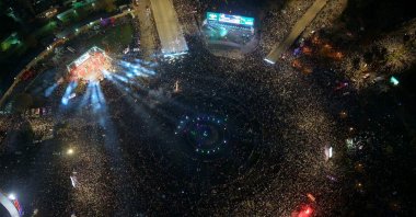 An aerial photograph shows thousands of people celebrating the first anniversary since the ousting of longtime ruler Bashar Assad, Omayyad Square, Damascus, Syria, Dec. 8, 2025. (AFP Photo)