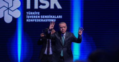 President Recep Tayyip Erdoğan greets the audience as he arrives for the TISK event, Ankara, Türkiye, Dec. 11, 2025. (AA Photo)