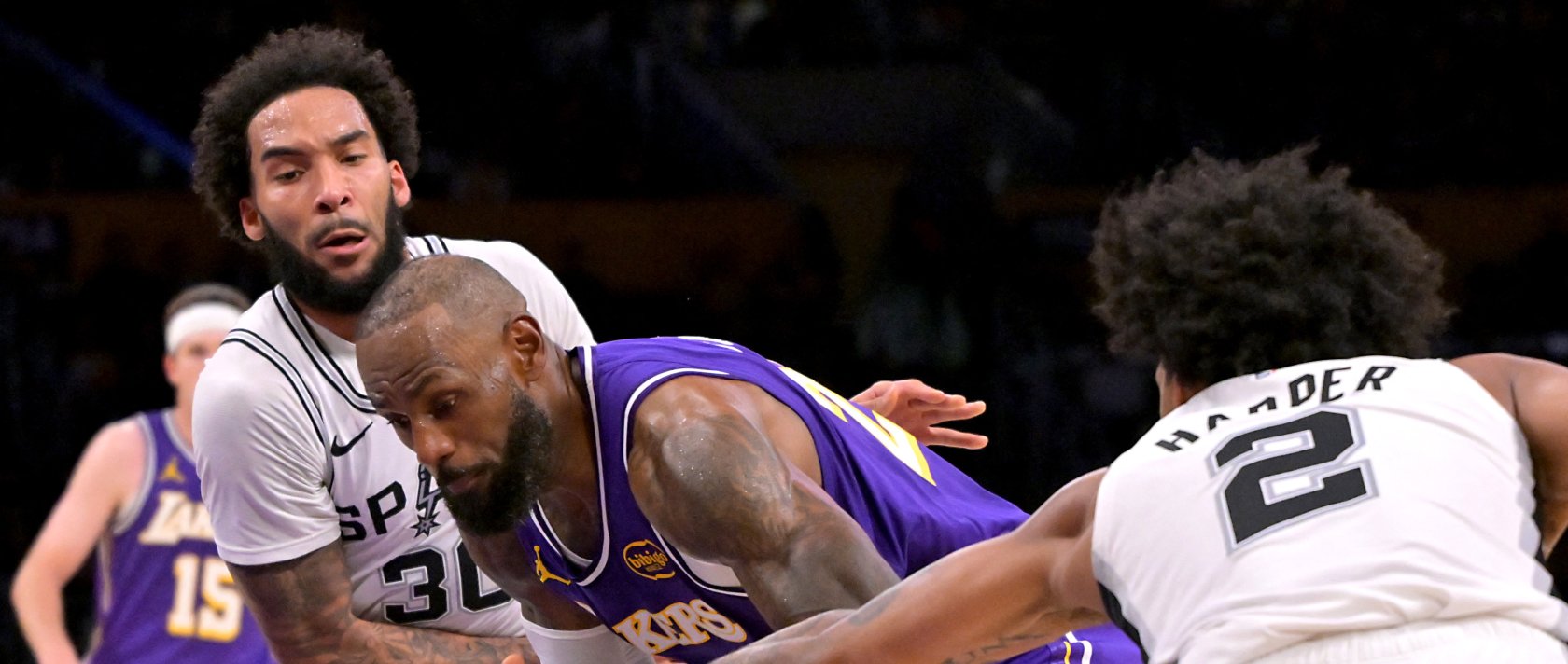 San Antonio Spurs&#039; Julian Champagnie (L) and guard Dylan Harper (R) defend Los Angeles Lakers forward Lebron James during the second half at Crypto.com Arena, Los Angeles, U.S., Dec. 10, 2025. (Reuters Photo)