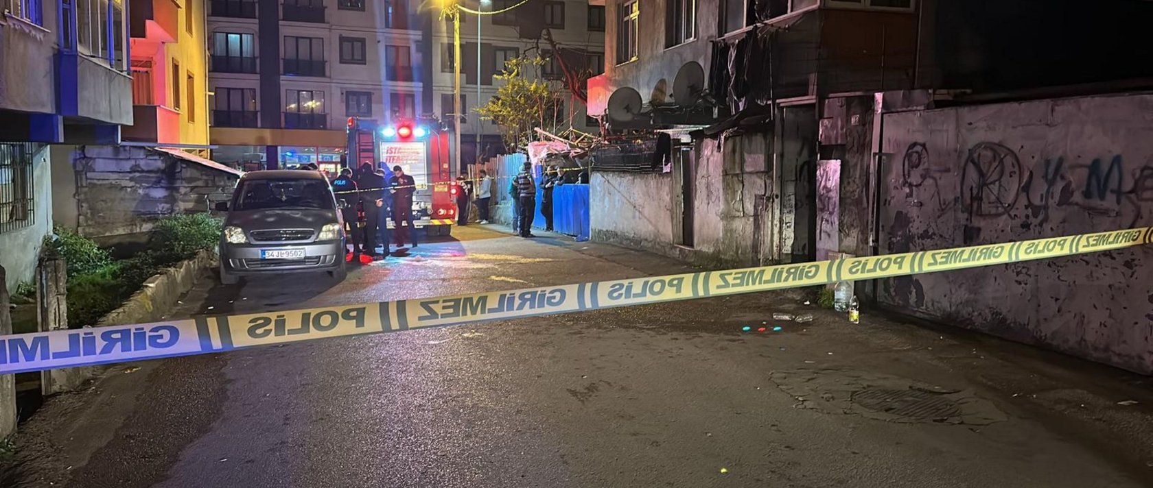 Firefighters conduct response and assessment work outside the burnt building, Pendik, Istanbul, Dec. 11, 2025. (AA Photo)