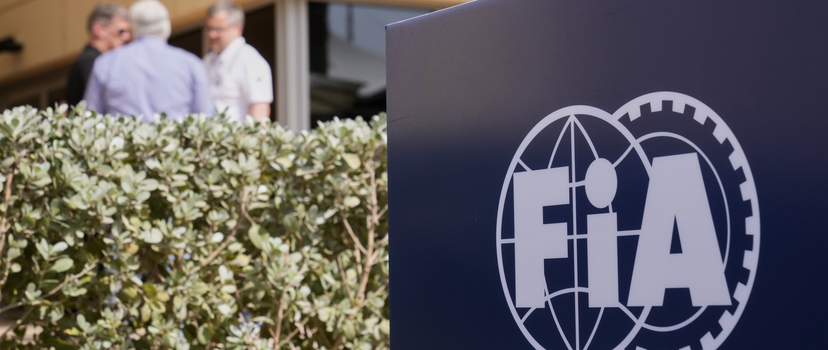 The FIA logo is displayed in the paddock ahead of the Formula One Bahrain Grand Prix at the Bahrain International Circuit, Sakhir, Bahrain, April 10, 2025. (AP Photo)