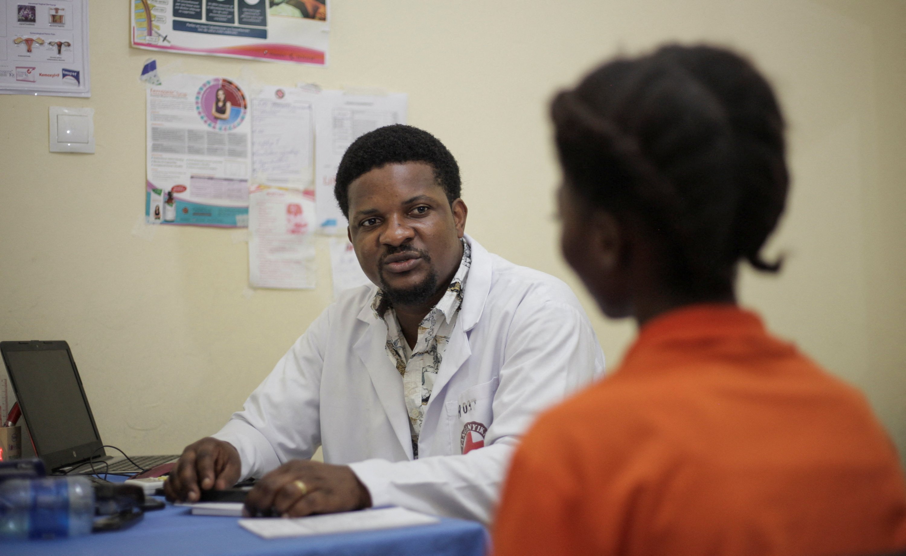 Dr. Aganze Mweze Gloire chats with patient and an M23 rape victim, Simon, a 16-year-old girl, Bujumbura, Burundi, May 24, 2025. (Reuters Photo)