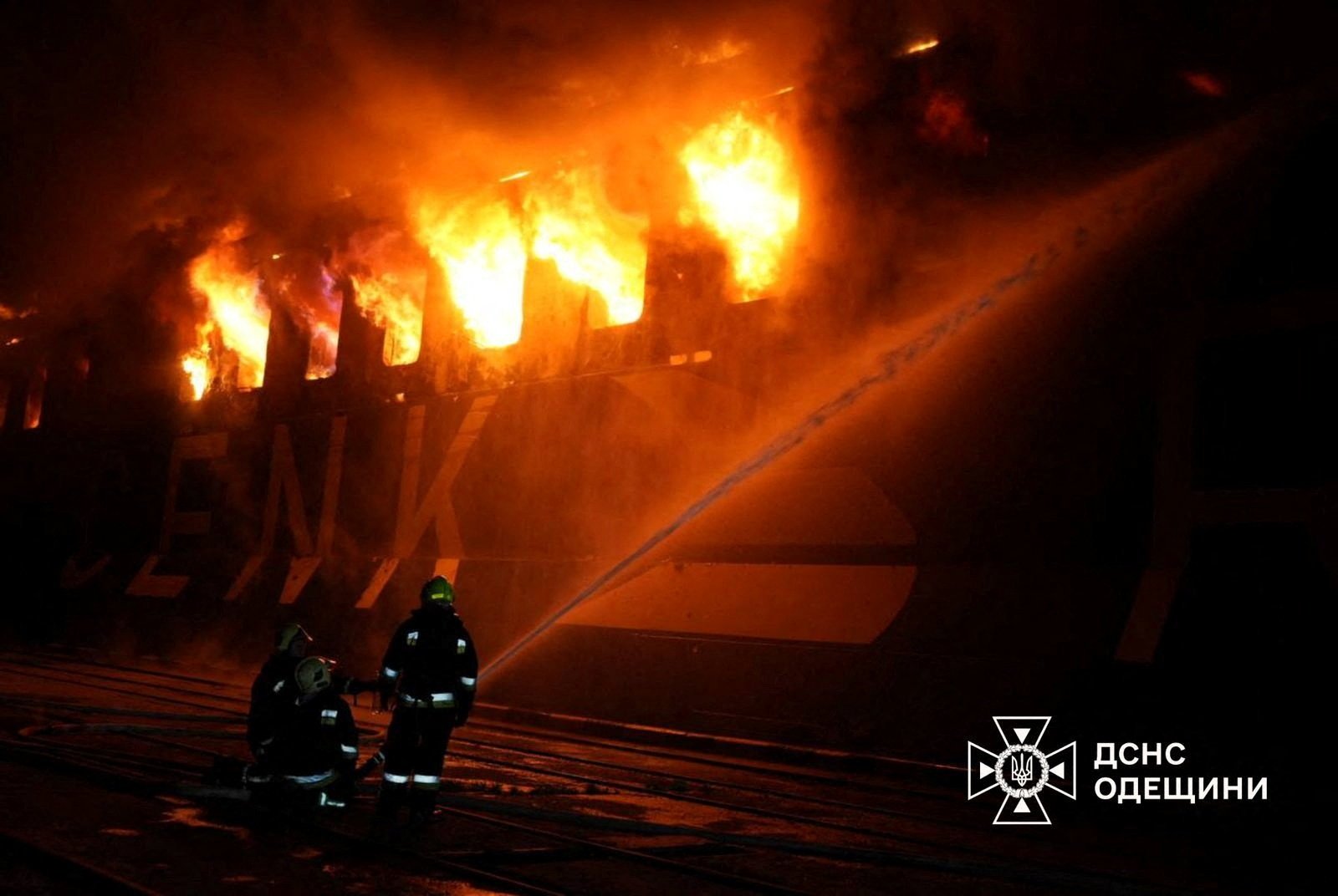 Firefighters work at the site of a civilian vessel hit during a Russian missile strike, amid Russia's attack on Ukraine, in the town of Chornomorsk, Odesa region, Ukraine, in this handout picture released Dec.12, 2025. (Press service of the State Emergency Service of Ukraine in Poltava region/Handout via Reuters)