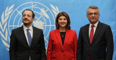 TRNC President Tufan Erhürman (R), U.N. envoy on Cyprus, Maria Angela Holguin Cuellar (C), and Greek Cypriot head Nikos Christodoulides (L), Lefkoşa (Nicosia), U.N. buffer zone, Dec. 11, 2025. (Reuters Photo)
