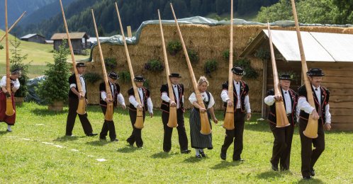 A group of Swiss Alphorn blowers arrive at the Yodel Festival in Davos, Switzerland, July 5, 2014. (AP Photo)
