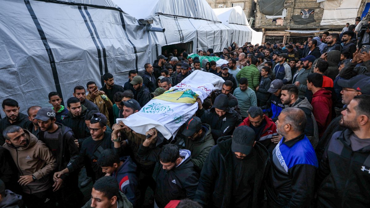 Mourners carry bodies during the funeral of Hamas's senior commander Raed Saed and his aides, who were killed in an Israeli strike a day earlier, in Gaza City, Palestine, Dec. 14, 2025. (Reuters Photo)