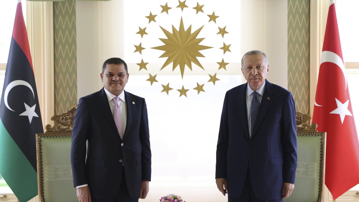 President Recep Tayyip Erdoğan poses with Prime Minister Abdul Hamid Mohammed Dbeibah of Libya's internationally recognized government, Istanbul, Türkiye, Aug. 7, 2021. (AP Photo)