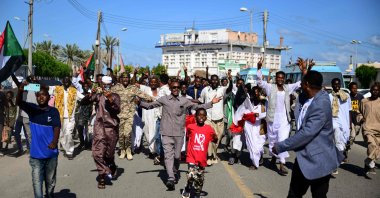 Sudanese take to the streets during a rally in support of the army, in the eastern Red Sea port of Port Sudan, Sudan, Dec. 13, 2025. (AFP Photo)