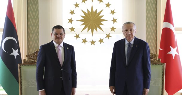 President Recep Tayyip Erdoğan poses with Prime Minister Abdul Hamid Mohammed Dbeibah of Libya's internationally recognized government, Istanbul, Türkiye, Aug. 7, 2021. (AP Photo)