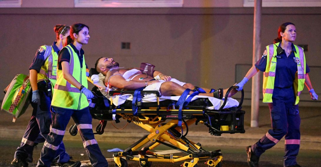 Health workers move a man on a stretcher to an ambulance after a shooting incident at Bondi Beach in Sydney, Australia, Dec. 14, 2025. (AFP Photo)
