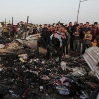 Palestinians look at the destruction after an Israeli strike where displaced people were staying in Rafah, the Gaza Strip, May 27, 2024. (AP Photo)