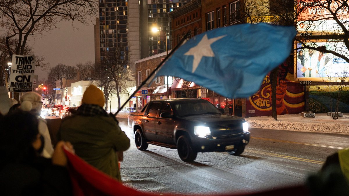 A vehicle passes as demonstrators rally in protest against Immigration and Customs Enforcement (ICE), amid a reported federal immigration operation targeting the Somali community, in Minneapolis, Minnesota, U.S., Dec. 8, 2025. (Reuters Photo)