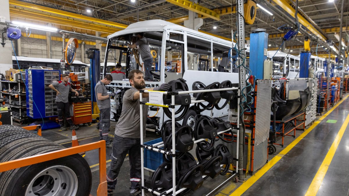 Technicians work on a bus at a production line of Türkiye's heavy commercial and armored vehicle manufacturer Otokar factory in Arifiye, a town in Sakarya province, Türkiye, July 13, 2023. (Reuters Photo)
