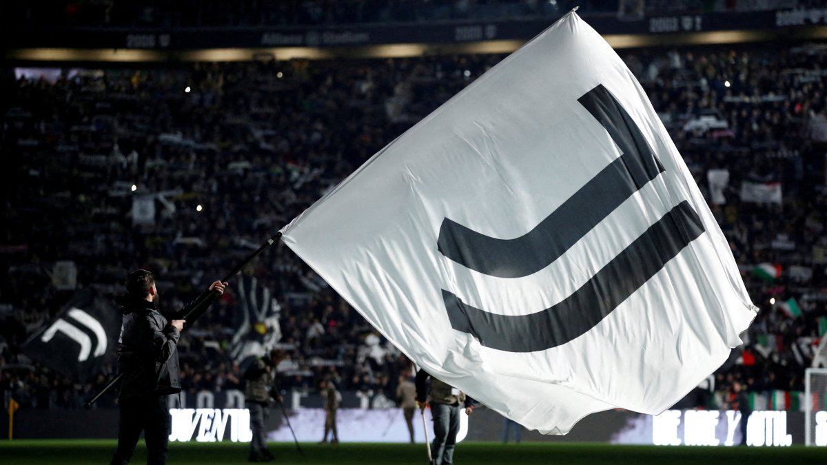 A Juventus flag is waved inside the stadium before the match, Turin, Italy, Nov. 8, 2025. (Reuters Photo)