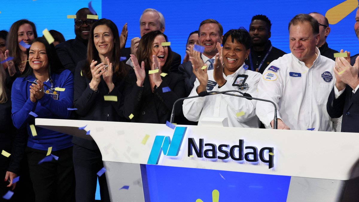 Walmart and Sam's Club executives and field associates celebrate the ringing of the opening bell at the Nasdaq Marketsite, in New York City, New York, U.S., Dec. 9, 2025. (AFP Photo)