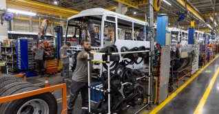 Technicians work on a bus at a production line of Türkiye's heavy commercial and armored vehicle manufacturer Otokar factory in Arifiye, a town in Sakarya province, Türkiye, July 13, 2023. (Reuters Photo)