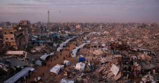 Palestinians walk past tents lining the streets amid the rubble of destroyed buildings in Jabalia, in the northern Gaza Strip, Feb. 18, 2025. (AFP File Photo)