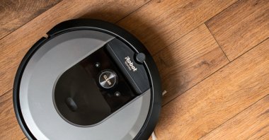 iRobot Roomba i7 robot vacuum cleaner on a wooden floor, Vilnius, Lithuania, May 5, 2021. (Shutterstock Photo)