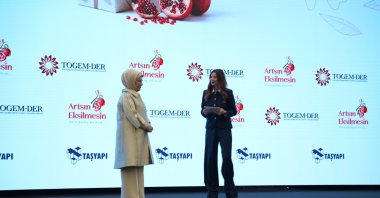 First lady Emine Erdoğan (L) and the event host, Funda Karayel, onstage at the "One Purchase, A Thousand Acts of Kindness" market, Istanbul, Türkiye, Dec. 13, 2025. (Courtesy of Funda Karayel)