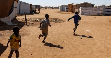 Sudanese refugee children from Darfur play in front of tents at the Iridimi refugee camp, Wadi Fira province, eastern Chad, Nov. 29, 2025. (Reuters Photo)