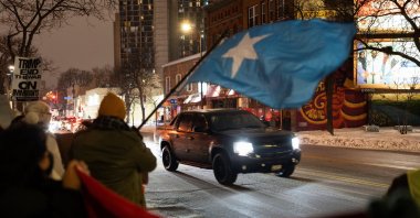 A vehicle passes as demonstrators rally in protest against Immigration and Customs Enforcement (ICE), amid a reported federal immigration operation targeting the Somali community, in Minneapolis, Minnesota, U.S., Dec. 8, 2025. (Reuters Photo)