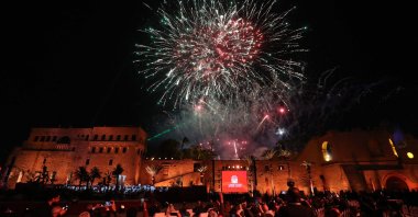 People look on as fireworks light up the sky over the historic Red Castle (As-Saraya al-Hamra) during the reopening ceremony of the National Museum, Tripoli, Libya, Dec. 12, 2025. (AFP Photo)