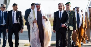 UAE President Sheikh Mohamed bin Zayed Al Nahyan (C-L) walking alongside Greek Cypriot administration head Nikos Christodoulides upon arriving at Larnaca airport, Dec. 14, 2025. (AFP Photo)