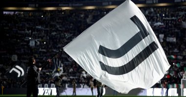 A Juventus flag is waved inside the stadium before the match, Turin, Italy, Nov. 8, 2025. (Reuters Photo)
