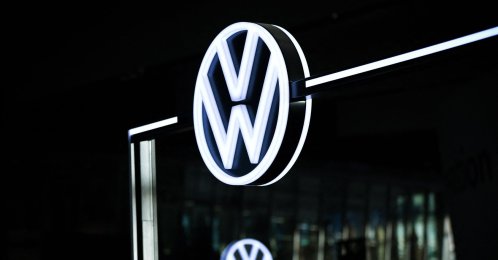 The illuminated VW logo is pictured in the customer centre at the headquarters of German carmaker Volkswagen (VW), Wolfsburg, Germany, Nov. 21, 2025. (AFP Photo)