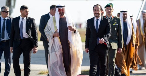 UAE President Sheikh Mohamed bin Zayed Al Nahyan (C-L) walking alongside Greek Cypriot administration head Nikos Christodoulides upon arriving at Larnaca airport, Dec. 14, 2025. (AFP Photo)