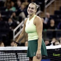 Belarus' Aryna Sabalenka reacts playing with U.S.' Tommy Paul against Japan's Naomi Osaka and Australia's Nick Kyrgios in a mixed doubles match during the Garden Cup at Madison Square Garden, New York City, U.S., Dec. 8, 2025. (AFP Photo)