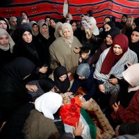Mourners react next to the body of 16-year-old Palestinian Ammar Sabbah, who was killed by Israeli soldiers in a West Bank raid, during his funeral in Tuqu' near Bethlehem in the Israeli-occupied West Bank, Dec.16, 2025. (Reuters Photo)