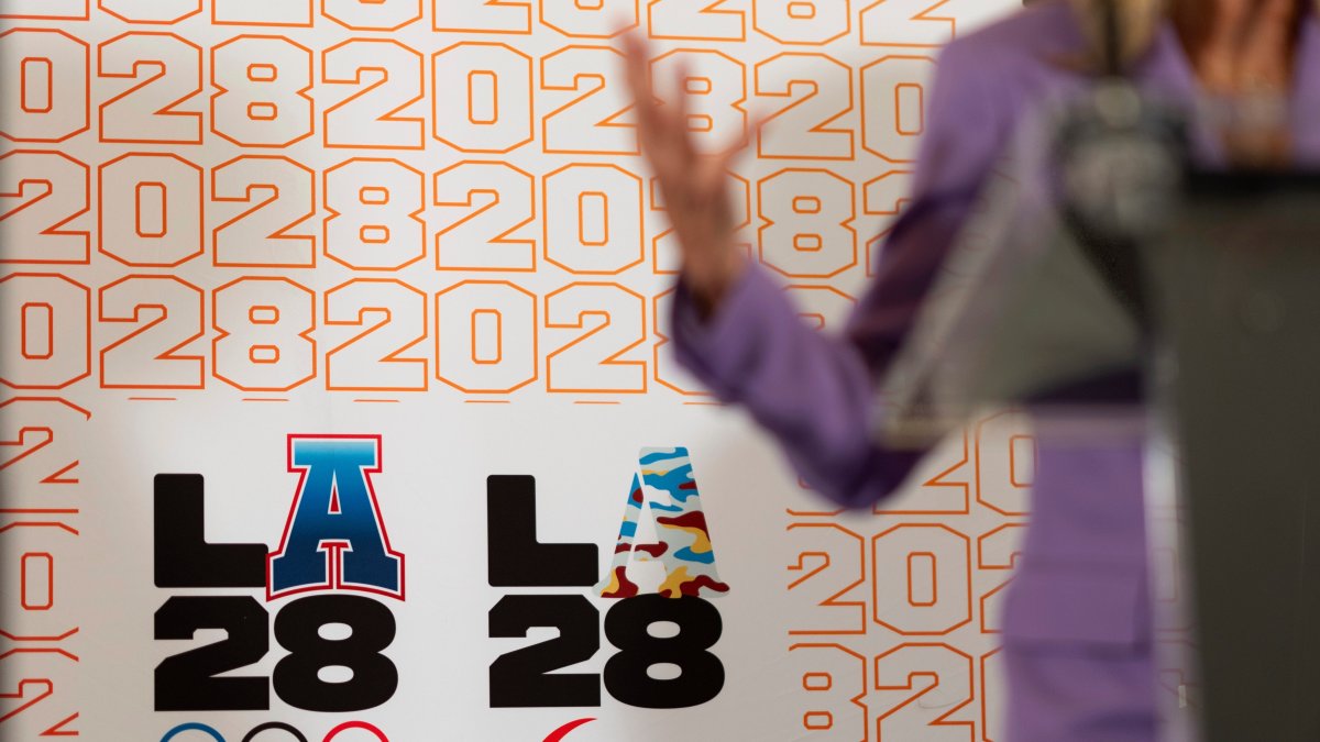 LA28 logos decorate a backdrop as First lady Jill Biden speaks at a reception at the U.S. Chief of Mission Residence to commemorate the opening of the 2024 Summer Olympics and celebrate the upcoming 2028 LA Olympic Games, Paris, July 27, 2024. (AP Photo)