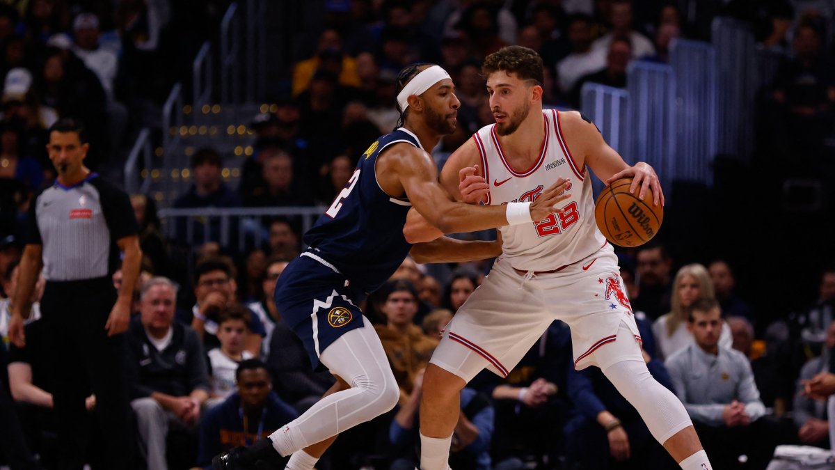 Houston's Alperen Şengün (R) dribbles against Denver Nuggets' Zeke Nnaji during the first quarter at Ball Arena, Denver, Colorado, Dec. 15, 2025. (AFP Photo)