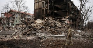 A Ukrainian police officer checks an area for residents in the front line town of Dobropillia, Donetsk region, Ukraine, Dec. 9, 2025. (Reuters Photo)