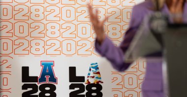 LA28 logos decorate a backdrop as First lady Jill Biden speaks at a reception at the U.S. Chief of Mission Residence to commemorate the opening of the 2024 Summer Olympics and celebrate the upcoming 2028 LA Olympic Games, Paris, July 27, 2024. (AP Photo)