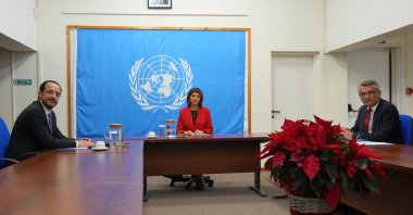 TRNC President Tufan Erhürman (R), U.N. envoy on Cyprus Maria Angela Holguin Cuellar (C) and Greek Cypriot administration leader Nikos Christodoulides (L) meet for talks at the U.N. buffer zone, Lefkoşa (Nicosia), the island of Cyprus, Dec.11, 2025. (Reuters Photo)