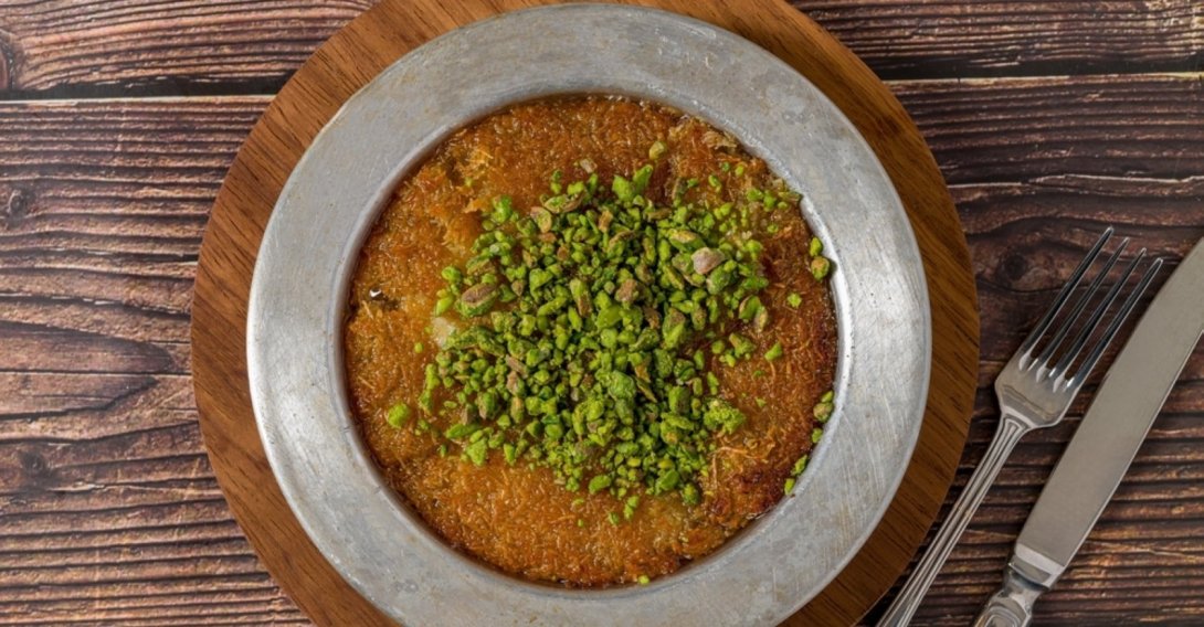 Antakya künefe served with pistachios on top. (Shutterstock Photo)
