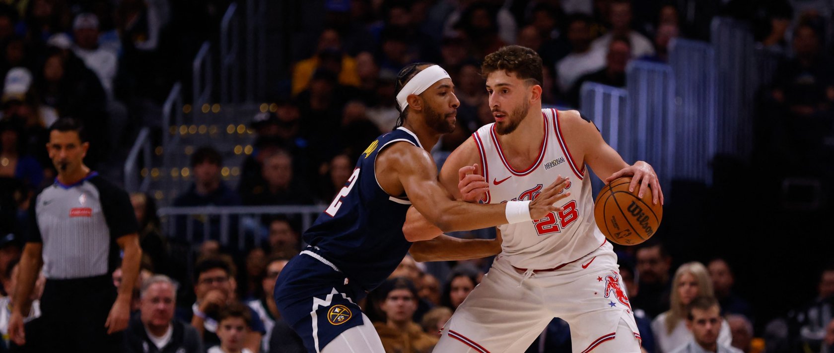 Houston's Alperen Şengün (R) dribbles against Denver Nuggets' Zeke Nnaji during the first quarter at Ball Arena, Denver, Colorado, Dec. 15, 2025. (AFP Photo)