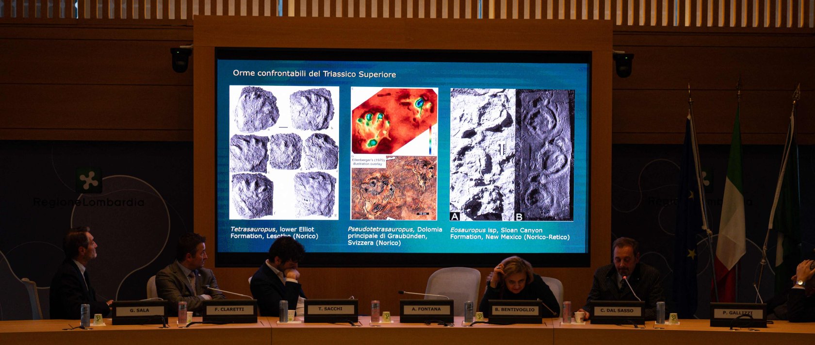 Paleontologist at the Natural History Museum of Milan Cristiano Dal Sasso, comments on a screen during a news conference to present the discovery of thousands of dinosaur tracks discovered in Italy's Stelvio National Park near the areas that will host the Milano-Cortina 2026 Olympic Games, in Milan, Dec. 16, 2025. (AFP Photo)