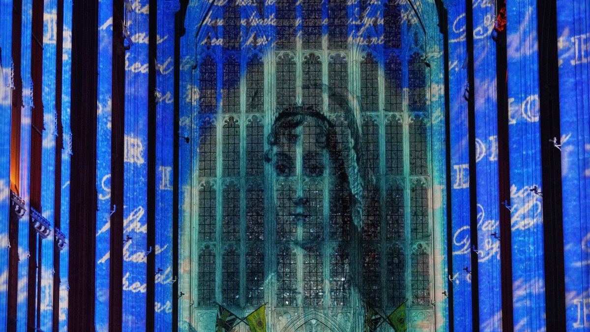 A sound and light show with a literary theme developed by Luxmuralis, which includes a section on writer Jane Austen, is screened inside Winchester Cathedral in Winchester, U.K., March 11, 2025. (AP Photo)