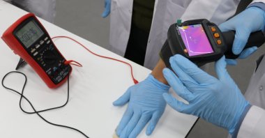 A researcher tests a locally developed device that converts waste heat into electrical energy at Sivas University of Science and Technology, Sivas, eastern Türkiye, Dec. 17, 2025. (IHA Photo)