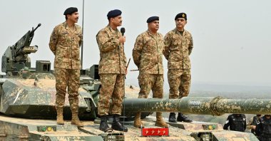 Chief of Army Staff of Pakistan Asim Munir (2nd L) speaks during his visit to the Tilla Field Firing Ranges (TFFR) in Mangla, Pakistan, May 1, 2025. (Reuters Photo)