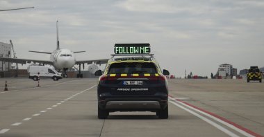 A “follow me” vehicle operates on the apron at Sabiha Gökçen International Airport in Istanbul, Türkiye, Dec. 17, 2025. (AA Photo)
