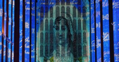 A sound and light show with a literary theme developed by Luxmuralis, which includes a section on writer Jane Austen, is screened inside Winchester Cathedral in Winchester, U.K., March 11, 2025. (AP Photo)